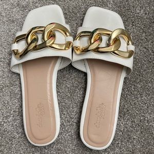 White With gold chain sandals